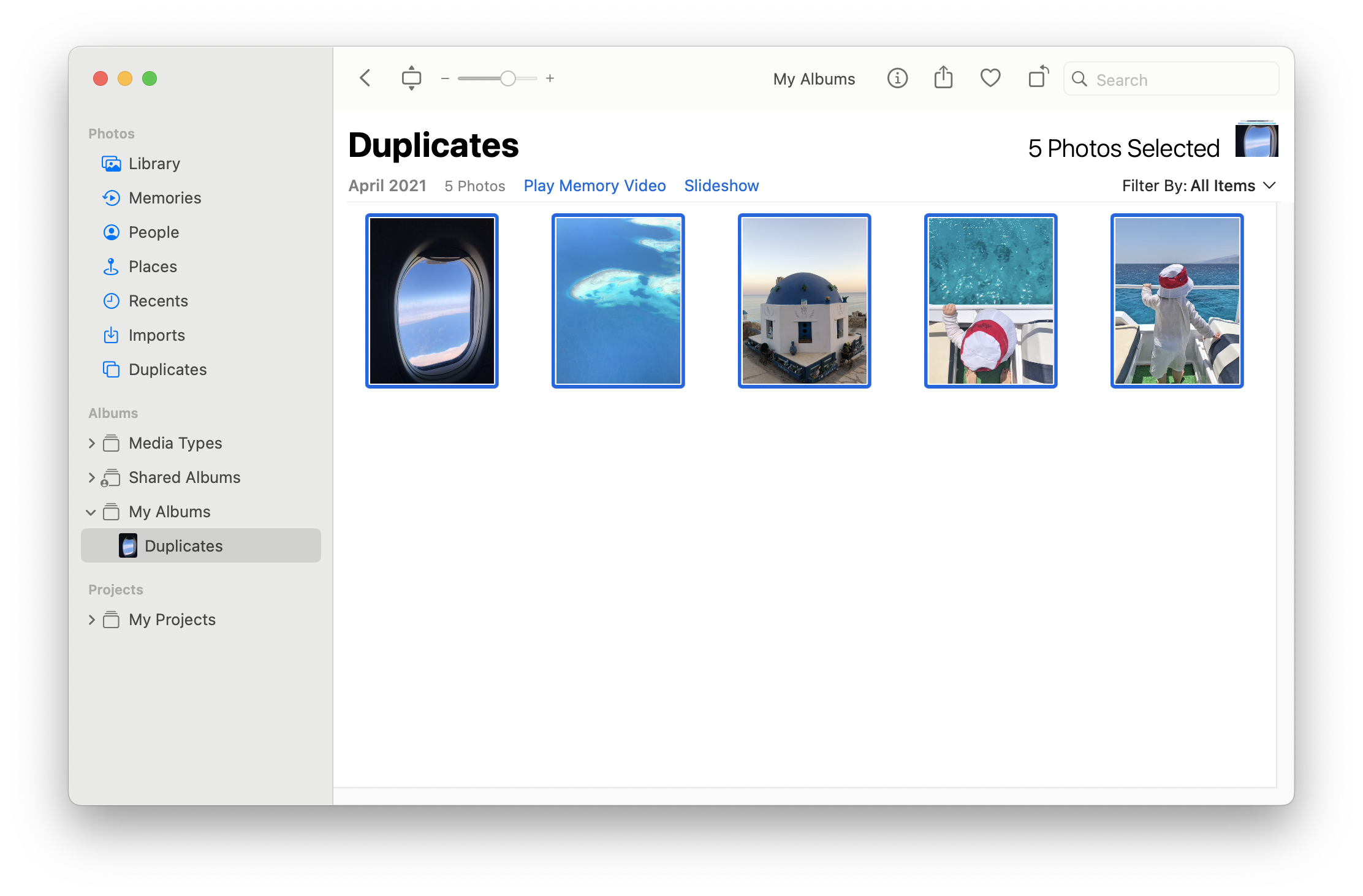 Photos app with selected pictures in Duplicates album