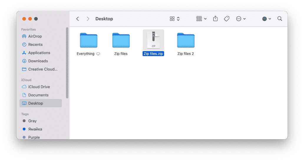 Finder window showing zipped and unzipped file