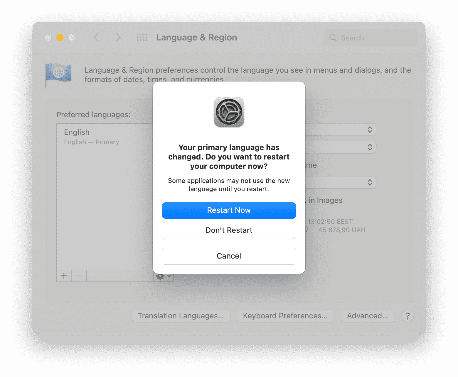 popup showing a restart mac button to change the language